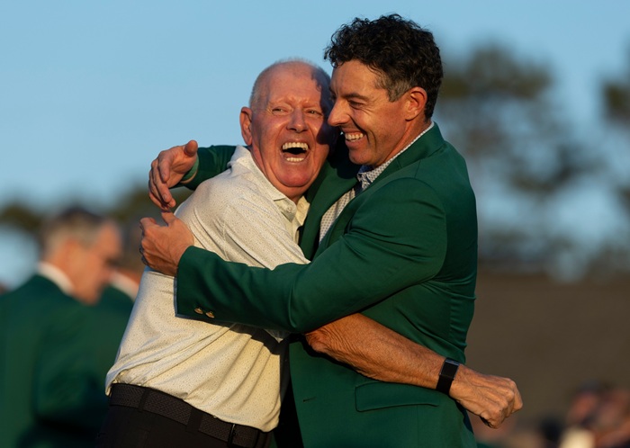 Masters champion Rory McIlroy of Northern Ireland and father Gerry McIIroy celebrate following the final round of the Masters at Augusta National Golf Club, Sunday, April 12, 2026.
